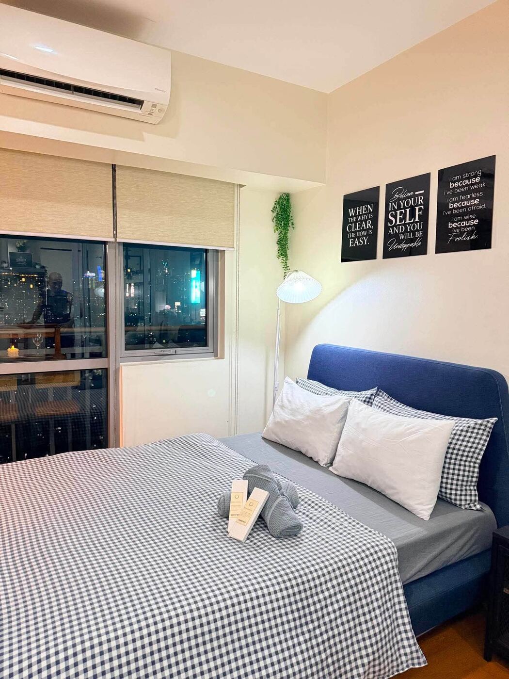 Bedroom at night with city view